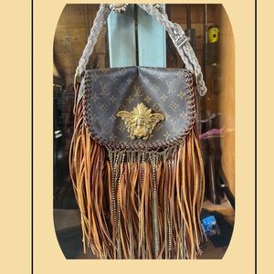 Louis Vuitton handle bag and can transform to a crossbody